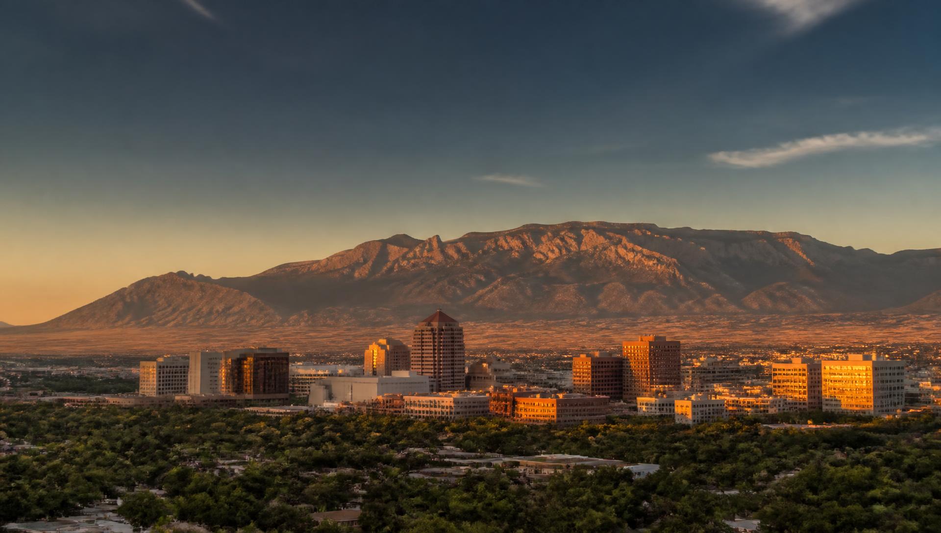 Downtown Albuquerque with the Sandia Mountains at sunset